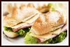 Sandu�ches Especiais (Servidos na Baguete) Bel�m - Ingredientes: Presunto di Parma, broto de alfafa, r�cula e tomate seco.