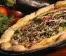 Pizzas Salgadas Berinjela - Ingredientes: Mussarela, piment�o, alho, berinjela e parmes�o.