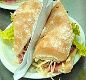 Sandu�ches Especiais (Servidos na Baguete) Palmas - Ingredientes: Picanha grelhada, queijo estepe derretido, mostarda Dijon, tomate e alface.