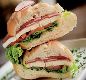 Sandu�ches Especiais (Servidos na Baguete) Vit�ria - Ingredientes: Filet Mignon, queijo branco derretido, mostarda Dijon, r�cula e rodelas de tomate na baguete.
